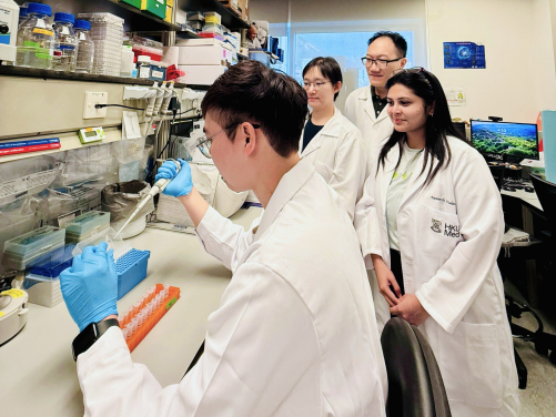 Dr Dittman Chung Lai-shun (left), the first author of the study, and other research team members identify a new risk factor and a set of key human genes regulated by EBV which can help predict the likelihood of cancer metastasis.
